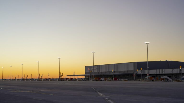 External view of Western Sydney International's 24-hour cargo precinct, with the sun low in the sky.