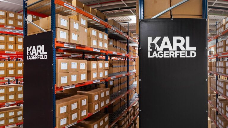 Karl Lagerfeld expands Bleckmann partnership with second Spanish fulfillment hub A Karl Lagerfeld-branded warehuose with stock in brown boxes on a range of shelves.