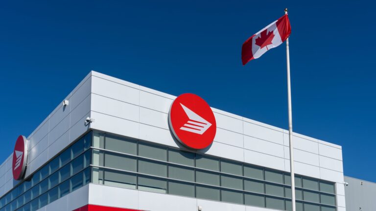 Canada Post narrows pre-tax loss as parcel volumes recover post labor deal Canada Post office building with the company logo outside.