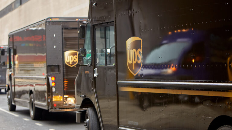 UPS announces executive changes and new global operating model A UPS van parked on a city street.